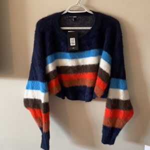 Cute, fuzzy, cropped long sleeve sweater. Size XS. Brand new!